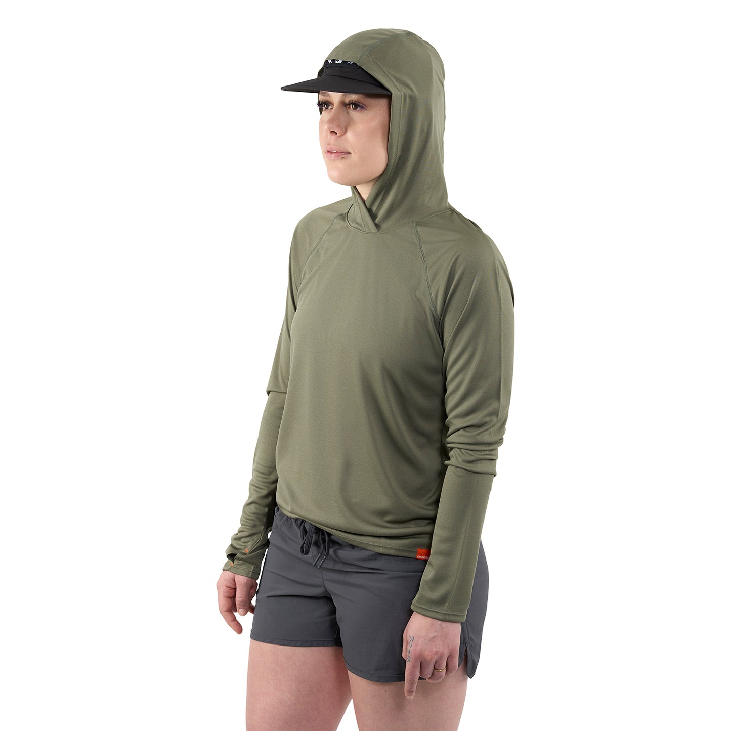 Long-sleeve olive green hoodie with a fitted hood, paired with gray shorts and a black cap.