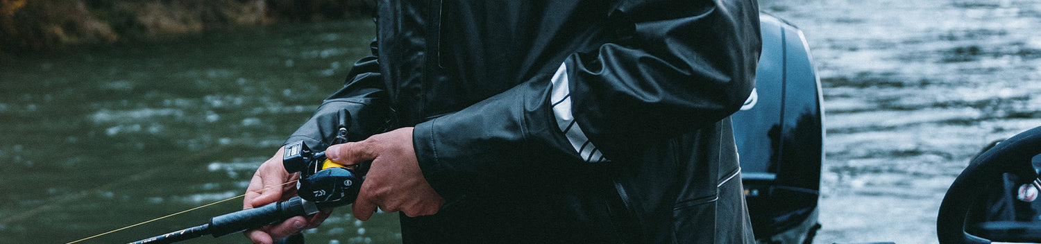 Angler wearing Grundens Jacket while fishing.