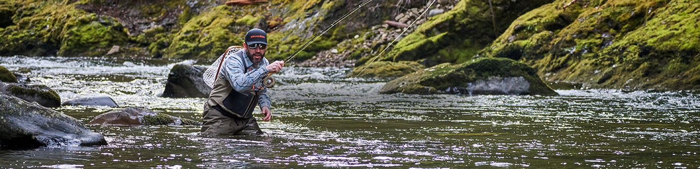 Grundens waders, angler casting and wading in river