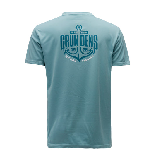 Light blue short-sleeve tech tee featuring a large anchor and "GRUNDENS 1926 WE ARE FISHING" graphic on the back.