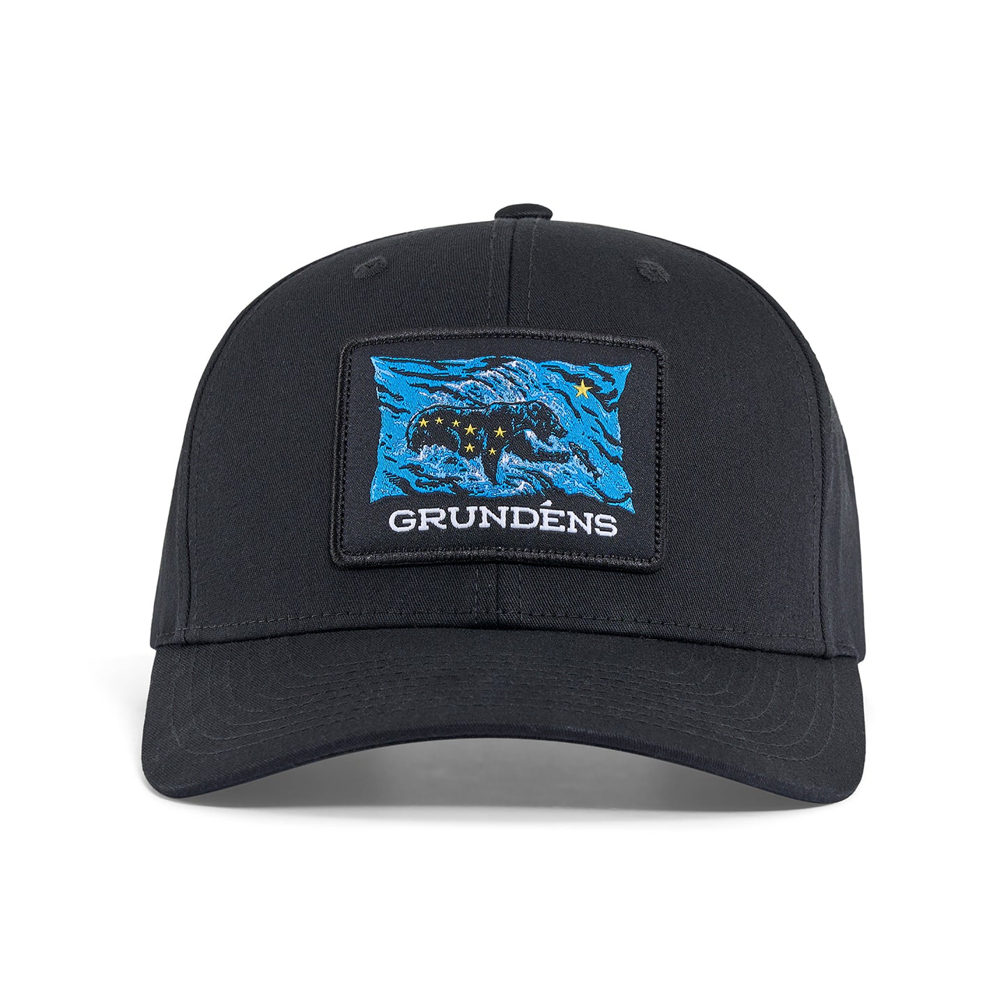 Black trucker hat featuring a blue and black bear patch with stars and the text "GRUNDÉNS."