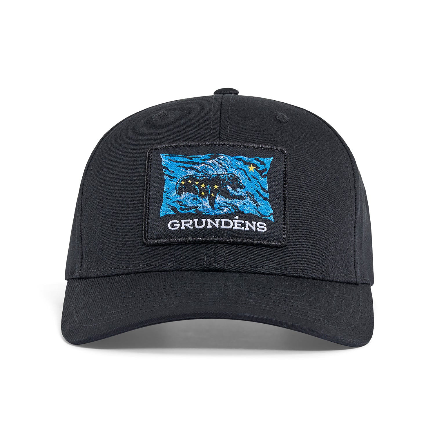 Black trucker hat featuring a blue and black bear patch with stars and the text "GRUNDÉNS."