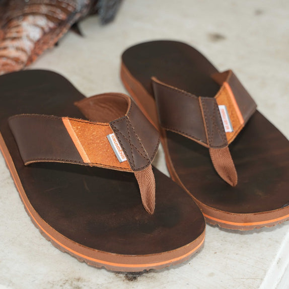 Premium, full-grain leather footbed and straps