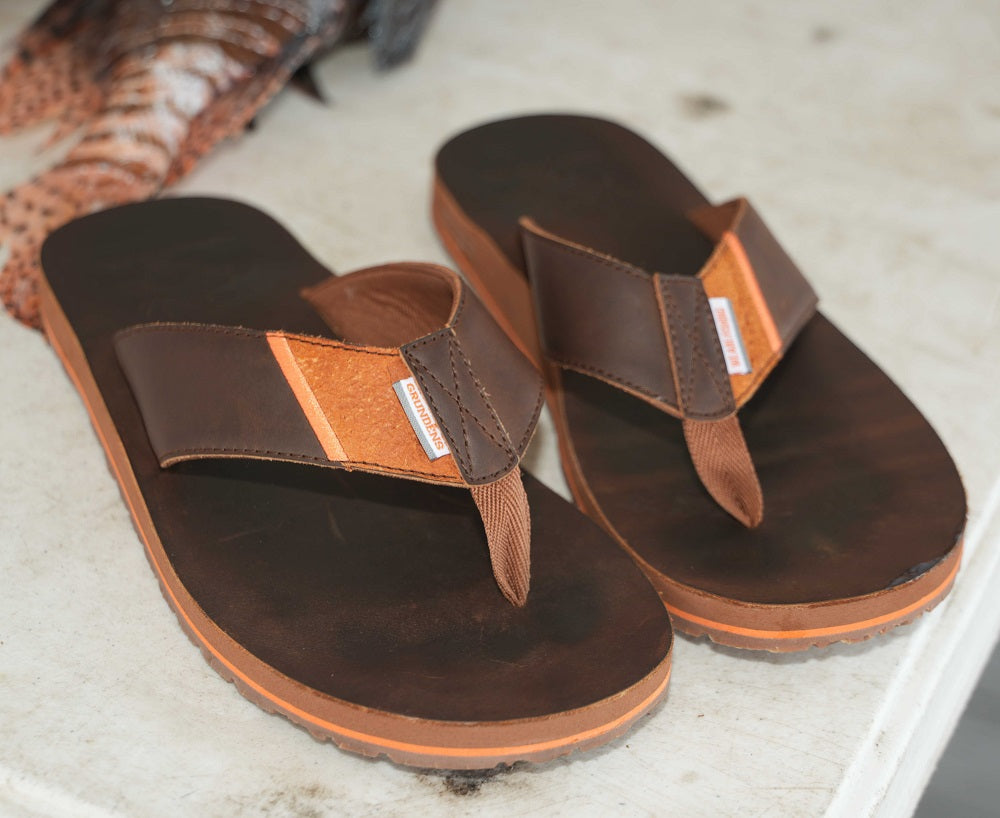 Premium, full-grain leather footbed and straps