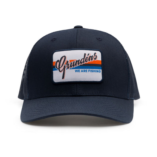 Navy trucker hat featuring a rectangular patch with "Grundén's" and "WE ARE FISHING" text.